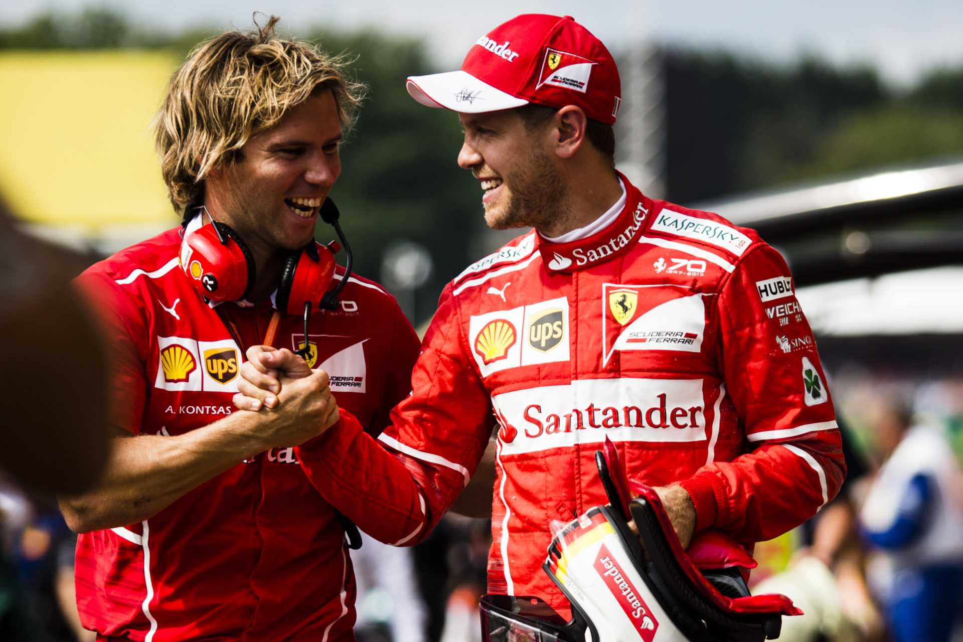 Formula One, F1- Scuderia Ferrari racer Sebastian Vettel (R) and his trainer Antti Kontsas (L)